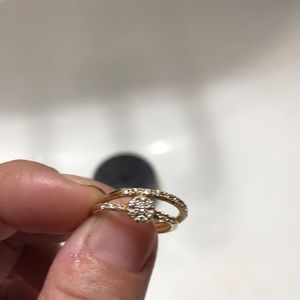 A diamond wedding band , engagement and wedding ring